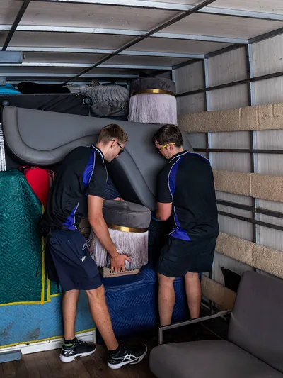 SwiftMove movers loading a truck outside a Brisbane property
