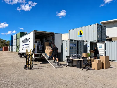 SwiftMove crew loading office desks, chairs and boxes into a truck during a Brisbane office relocation